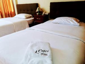 Letto o letti in una camera di Hostal Capri