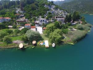 an island in the water with boats on it at Apartments Bogunovic in Ploče