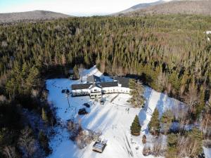 an aerial view of a resort in the snow at Carlson's Lodge in Twin Mountain