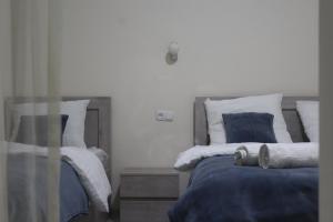 Voodi või voodid majutusasutuse Rooms 3 toas