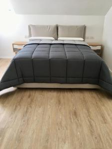 A bed or beds in a room at CORSO VENEZIA APARTMENT