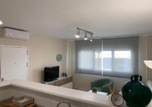 Telewizja i/lub zestaw kina domowego w obiekcie APARTAMENTO MARIPOSA II