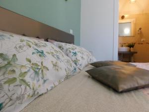 A bed or beds in a room at Porta alla Croce Guest House