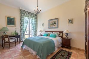 Postel nebo postele na pokoji v ubytování Hacienda las tres niñas