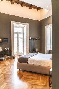 A bed or beds in a room at Relais Della Porta