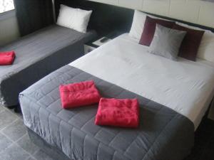 Postel nebo postele na pokoji v ubytování Motel Lodge