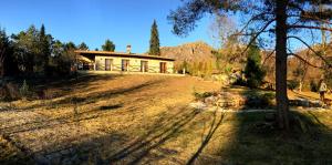 a house in the middle of a grass field at Casa Natura Gerês in Campo do Gerês +44 photos