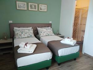 A bed or beds in a room at Porta alla Croce Guest House