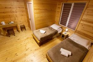 Postel nebo postele na pokoji v ubytování Cottage Shgedi
