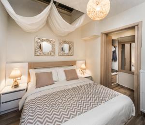 Postel nebo postele na pokoji v ubytování Lemar Luxury Apartments