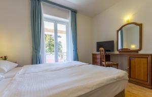 Ένα ή περισσότερα κρεβάτια σε δωμάτιο στο Hotel Marko