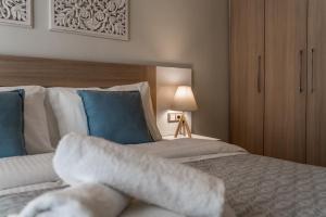 Postel nebo postele na pokoji v ubytování Lemar Luxury Apartments