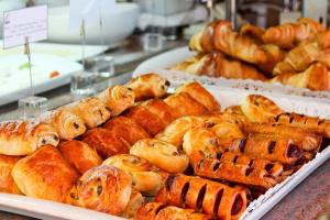 a display of pastries and other baked goods in a bakery at Occidental Faro in Faro