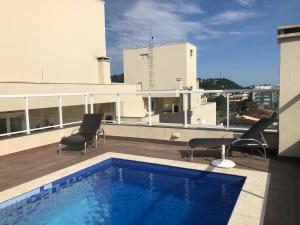 Bazén v ubytování Beach House Itaguá Apartamento 1 - Em Ubatuba a 300m da orla mais charmosa, com excelente localização nebo v jeho okolí