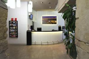 a store with a counter in the middle of a room at Best Western Lyon Saint-Antoine in Lyon