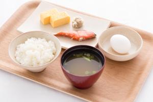a plate of food with rice and a bowl of milk at Hotel Brooks (Adult Only ) in Kasukabe