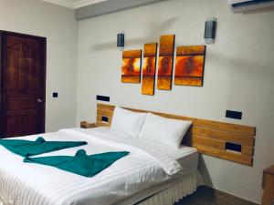 Voodi või voodid majutusasutuse IRIS Beach Residence toas