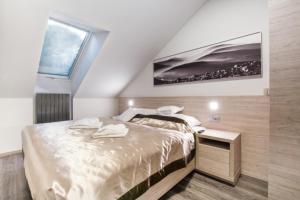 Postel nebo postele na pokoji v ubytování HOTEL PECR DEEP
