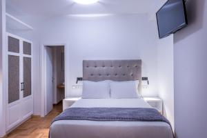 Posteľ alebo postele v izbe v ubytovaní Shapes Luxury Suites