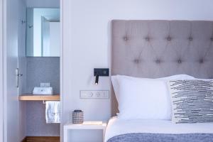 Posteľ alebo postele v izbe v ubytovaní Shapes Luxury Suites
