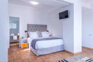 Posteľ alebo postele v izbe v ubytovaní Shapes Luxury Suites