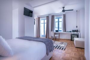 Posteľ alebo postele v izbe v ubytovaní Shapes Luxury Suites