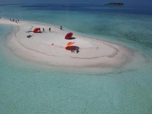 a group of people on a small island in the ocean at Season Paradise in Thulusdhoo