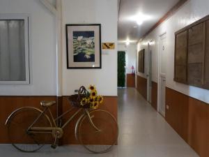 a hallway with a bike parked in a room at Travelbee Heritage Inn in Dapitan