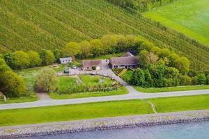 an aerial view of a house next to the water at Royale bovenwoning in Vlake