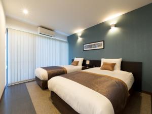 Кровать или кровати в номере Sumuide Terrace H