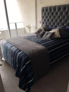 Кровать или кровати в номере Edificio Velas de Montemar