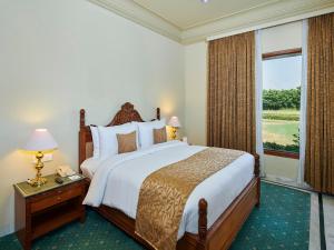 The Ummed Jodhpur Palace Resort & Spa客房内的一张或多张床位