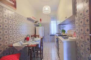 a kitchen with a table and a dining room at Costamare in Monterosso al Mare