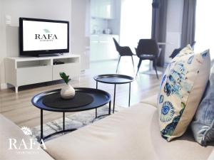 Televízia a/alebo spoločenská miestnosť v ubytovaní RAFA Apartments