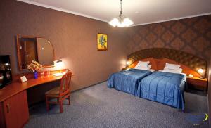Voodi või voodid majutusasutuse Luna Hotel toas