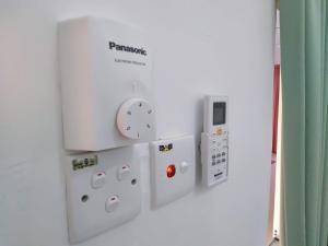 a nintendo wii controllers hanging on a wall at Jerantut Homestay 2 in Jerantut