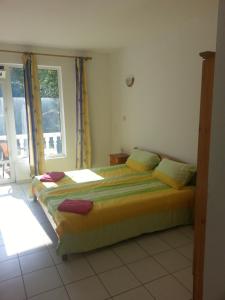 a bedroom with a large bed and a window at Family Hotel Casablanca Green in Varna City +79 photos
