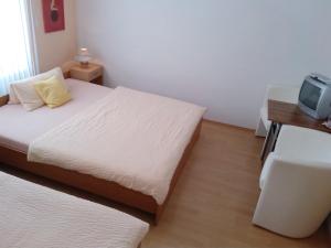 Posteľ alebo postele v izbe v ubytovaní Pension Motel Anna