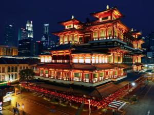 a chinese building with red lights at night at Wink at Mosque Street in Singapore
