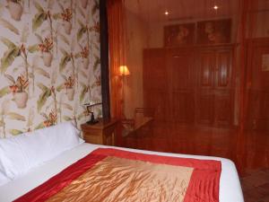 Postel nebo postele na pokoji v ubytování Hotel Katxi