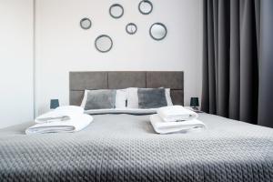 Posteľ alebo postele v izbe v ubytovaní Apartament Europejski