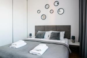 Posteľ alebo postele v izbe v ubytovaní Apartament Europejski