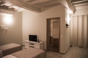 TV a/nebo společenská místnost v ubytování L’infinito residence
