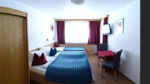 Postel nebo postele na pokoji v ubytování Hotel Restaurant Rosengarten