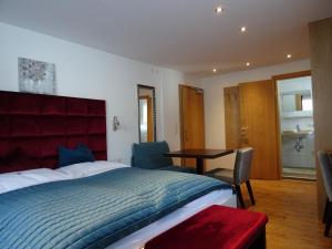 Postel nebo postele na pokoji v ubytování Hotel Restaurant Rosengarten