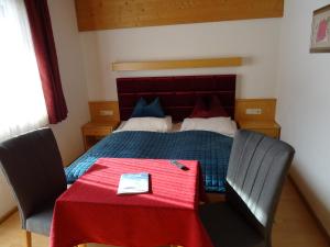 Postel nebo postele na pokoji v ubytování Hotel Restaurant Rosengarten