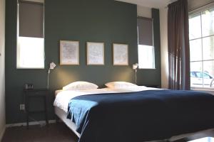 Een bed of bedden in een kamer bij Landgoed Het Rheins
