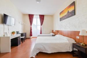 Posteľ alebo postele v izbe v ubytovaní Roma Enrico Guesthouse