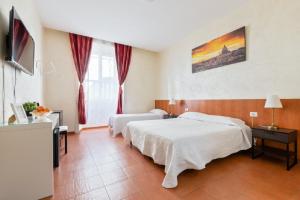Posteľ alebo postele v izbe v ubytovaní Roma Enrico Guesthouse
