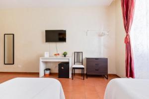 Posteľ alebo postele v izbe v ubytovaní Roma Enrico Guesthouse